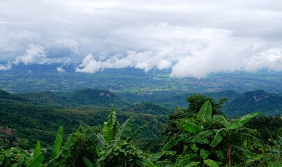 View from the top, seeing the sky, mountains and wide forests.