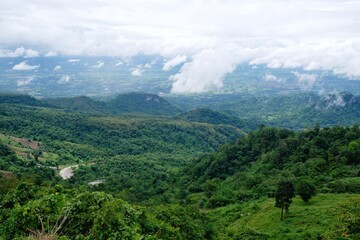 View from the top, seeing the sky, mountains and wide forests.
