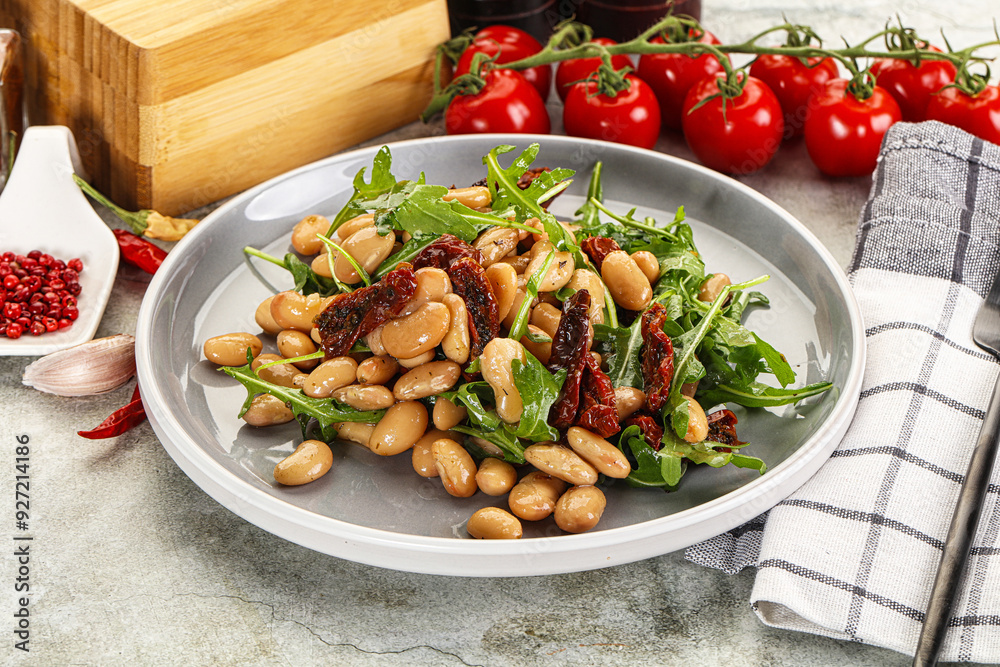 Sticker white canned beans with arugula and dry tomatoes