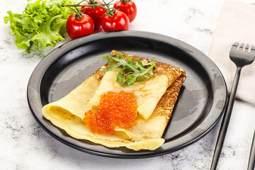 Russian pancake with red caviar
