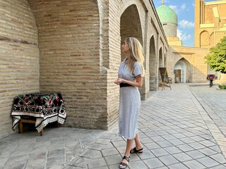 Woman admiring traditional architecture at Hast Imam Complex, Tashkent