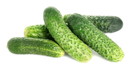 Pile of whole fresh cucumbers isolated on white