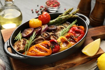 Delicious grilled vegetables in baking dish on table, closeup