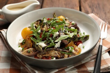 Tasty salad with grilled vegetables served on table, closeup