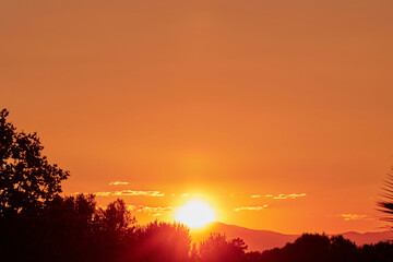 Setting Sun Sinking behind the Mountain