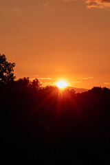 Setting Sun Sinking behind the Mountain