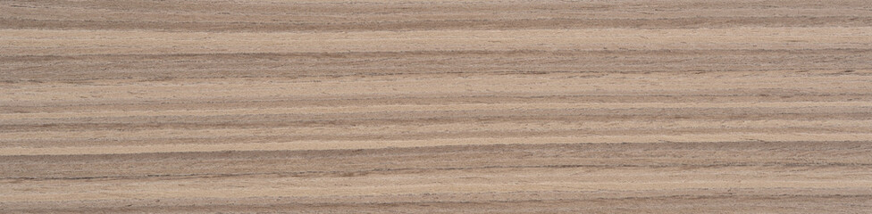 Flowing lines of natural Zebrano wood veneer blend shades of light oatmeal with dark coffee...