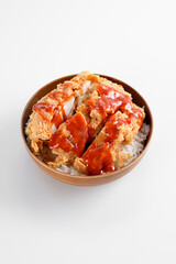 rice bowl with crispy chicken and drizzle of hot sauce, looks so delicious