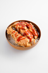 rice bowl with crispy chicken and drizzle of hot sauce, looks so delicious