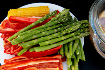 Paprika, corn cob, asparagus for grill. Vegetables prepared for grill