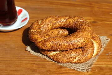 turkish tea and turkish bagels (simit) on wooden table