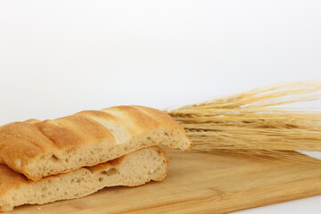 sliced  turkish pide bread (round flatbread) on wood