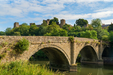 Fototapeta premium Dinham bridge over the River Teme with Ludlow castle behind in the town of Ludlow, Shropshire UK in Landscape orientation