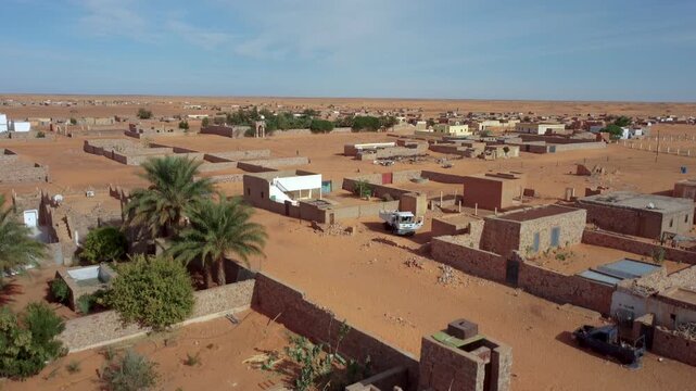 Chinguetti city, Sahara desert, Mauritania. Rising drone shot, boom shot, reveal