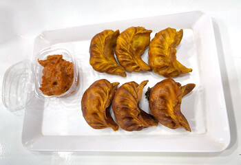Plate of fried momos with sauce