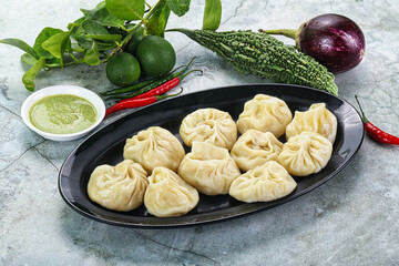 Nepali steamed dumplings  Momo with sause