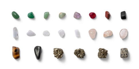 This display features an assortment of colorful gemstones and crystals positioned on a white surface, highlighting their intricate textures and hues