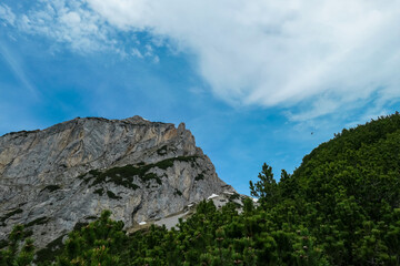 Panoramic view of majestic mountain peak Sinabell and Wasenspitze in Schladming, Schladminger Tauern, Styria, Austria. Hiking trail in Austrian Alps in spring. Remote alpine landscape. Wanderlust
