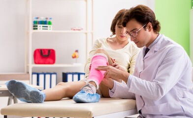 Young woman visiting doctor traumatologist