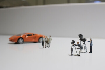 a movie making of small figure at the white background