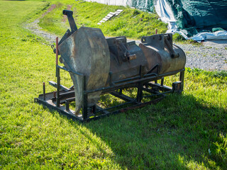 Three excavator shovels in backlight