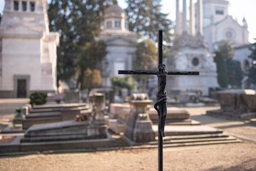 Fototapeta premium Detail of a cross in the Monumental Cemetery of Milan