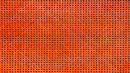 Obraz premium abstract geometric pattern of red wooden basketwork, stylish texture background for handicraft, craft, cultural, traditional concept. wicker mesh texture. rattan background.