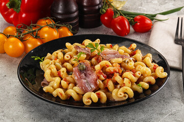 Italian pasta cellentani with anchovy