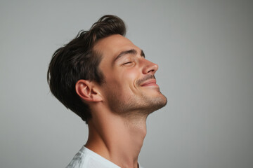 Fototapeta premium A close up of a man's face with her eyes closed