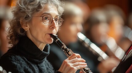 A woman is playing a flute in front of a crowd