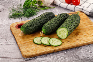 Raw green cucumbers with slices