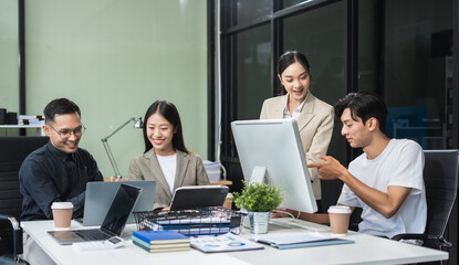Obraz premium Business team working on a project in the office or reviewing and discussing a business project.