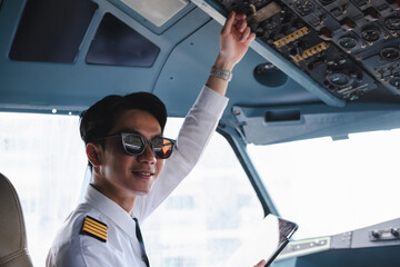 Successful serious airplane captain pilot preparing for flight at Airport.