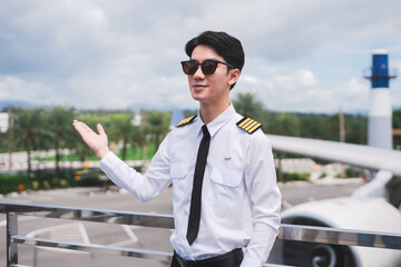 Portrait of a trained airplane captain in uniform preparing to fly.