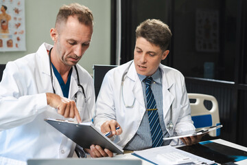 Medical team working on digital tablet healthcare doctor technology tablet using x-ray film analyzed the results of medical reports.