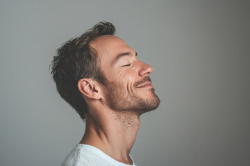 Fototapeta premium A close up of a man's face with her eyes closed