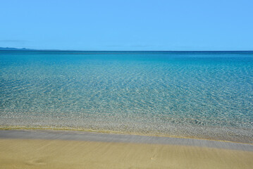 Empty sandy tropical exotic beach with with golden sand.