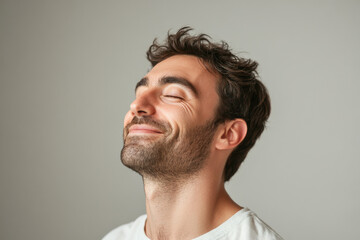 Fototapeta premium A close up of a man's face with her eyes closed