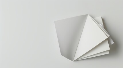 Blank magazine displayed with pages fanning out to create an abstract geometric design