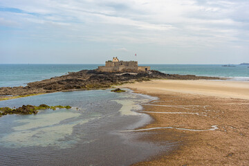  France: View of Fort National, a granite fortress from the 1600s, located on an islet adjacent to Saint Malo and accessible at low tide.