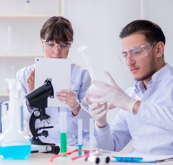 Team of chemists working in the lab