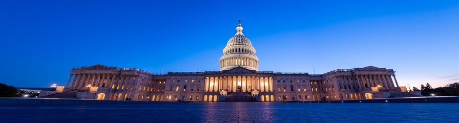 Wide Angle Panorama of the US Capitol at Night with all Lights on and clear skies