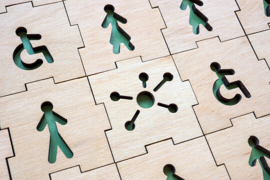Puzzle with figures, disability person and sign of unity and inclusion. Represent collaboration and support for diversity.