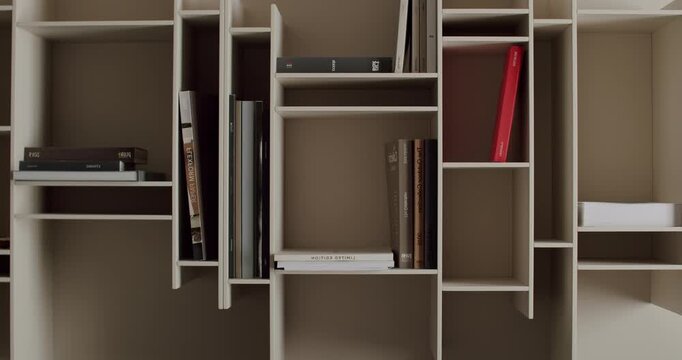 Contemporary bookshelf displaying a collection of books in an organized manner. Open shelves provide ample storage, showcasing a minimalist and modern design aesthetic.