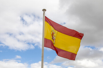 Vibrant Flag Against a Bright Sky: A Symbol of Strength and Beauty