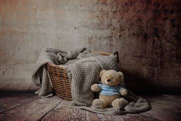 Baby nest with basket and knitted blanket