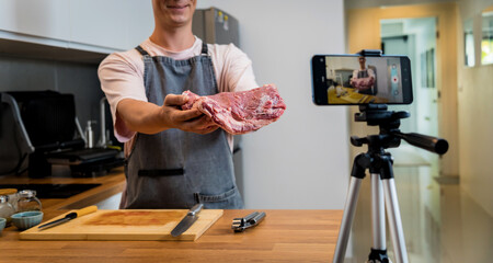 The chef is broadcasting live from workshop how to prepare a beef steaks on the electric grill