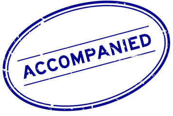 Grunge blue accompanied word oval rubber seal stamp on white background