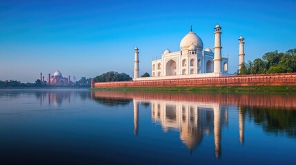 Fototapeta premium Scenic view of the Yamuna River with the iconic Taj Mahal in the background, reflecting peacefulness