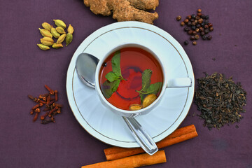tea and spices, A cup of masala ayurvedic tea with ingredients